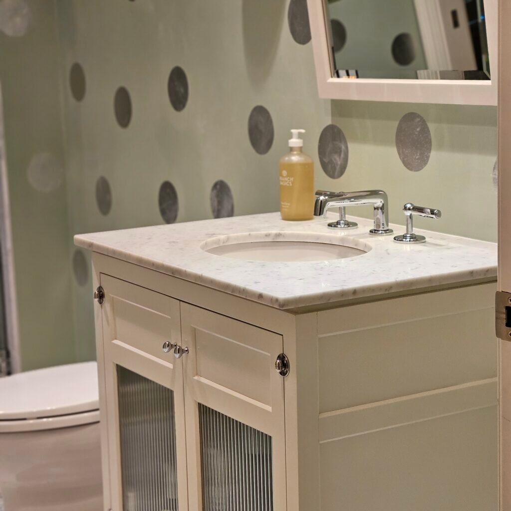 warm-toned bathroom with wood vanity